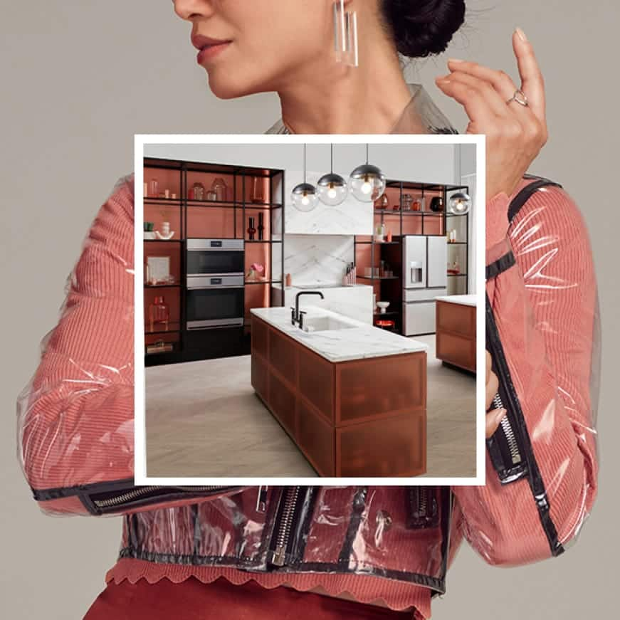 An image of a kitchen with sleek Cafe appliances is superimposed over a woman dressed in trendy clothes that match the kitchen.