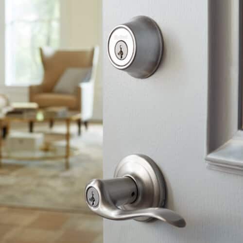 lever and lock on light grey entry door